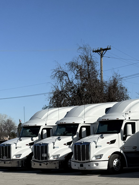 smith-transportation-drive-with-us_white-truck-lineup